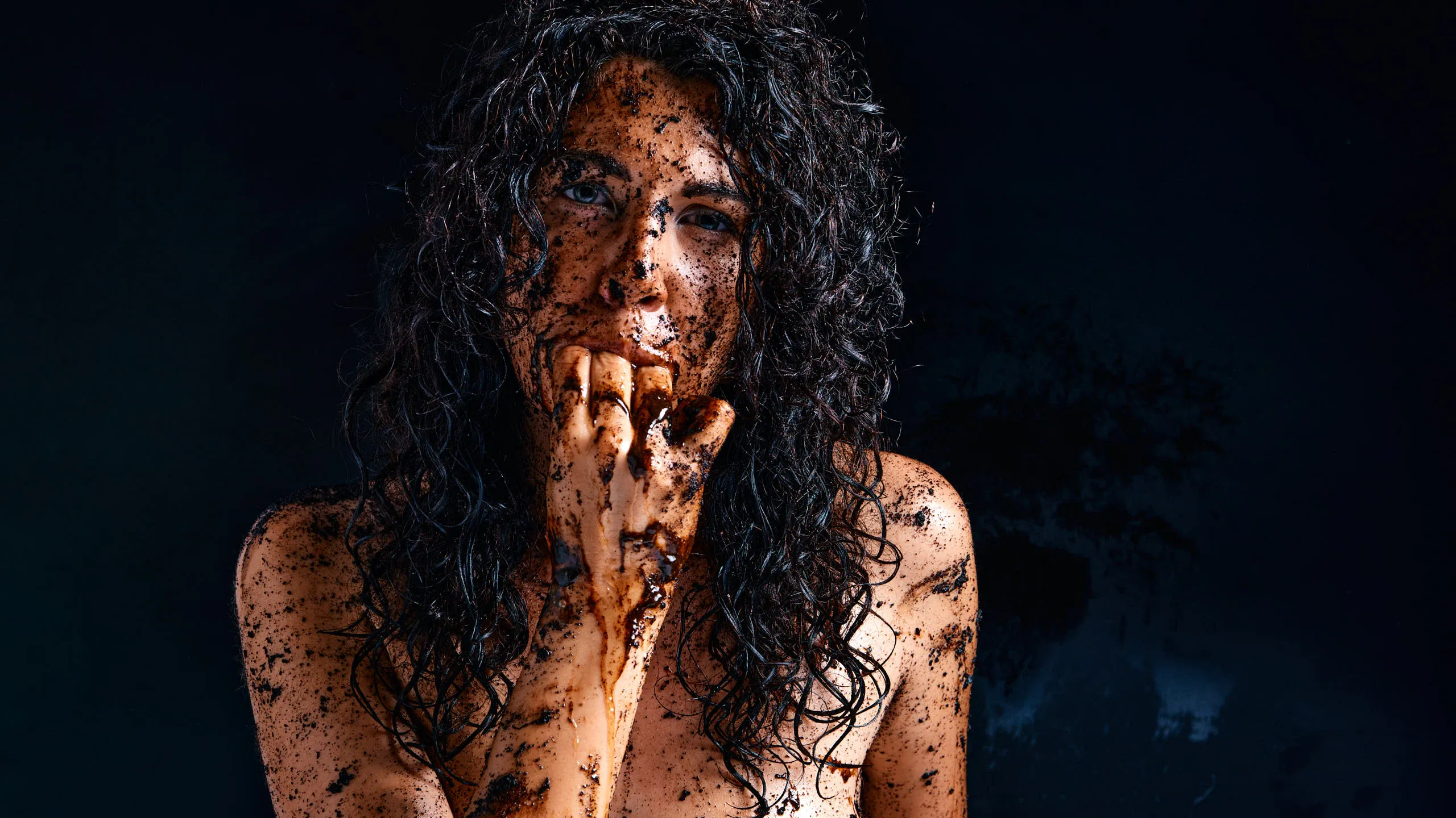 Gia Ren photographed in a raw close-up with a dirty aesthetic, focusing on facial expression, mood, and confrontational intimacy