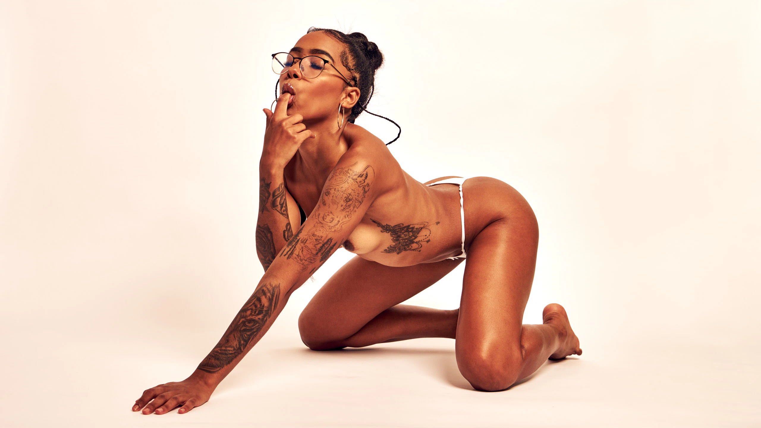 Erotic nude art portrait of African Beauty emphasizing sensual presence and form