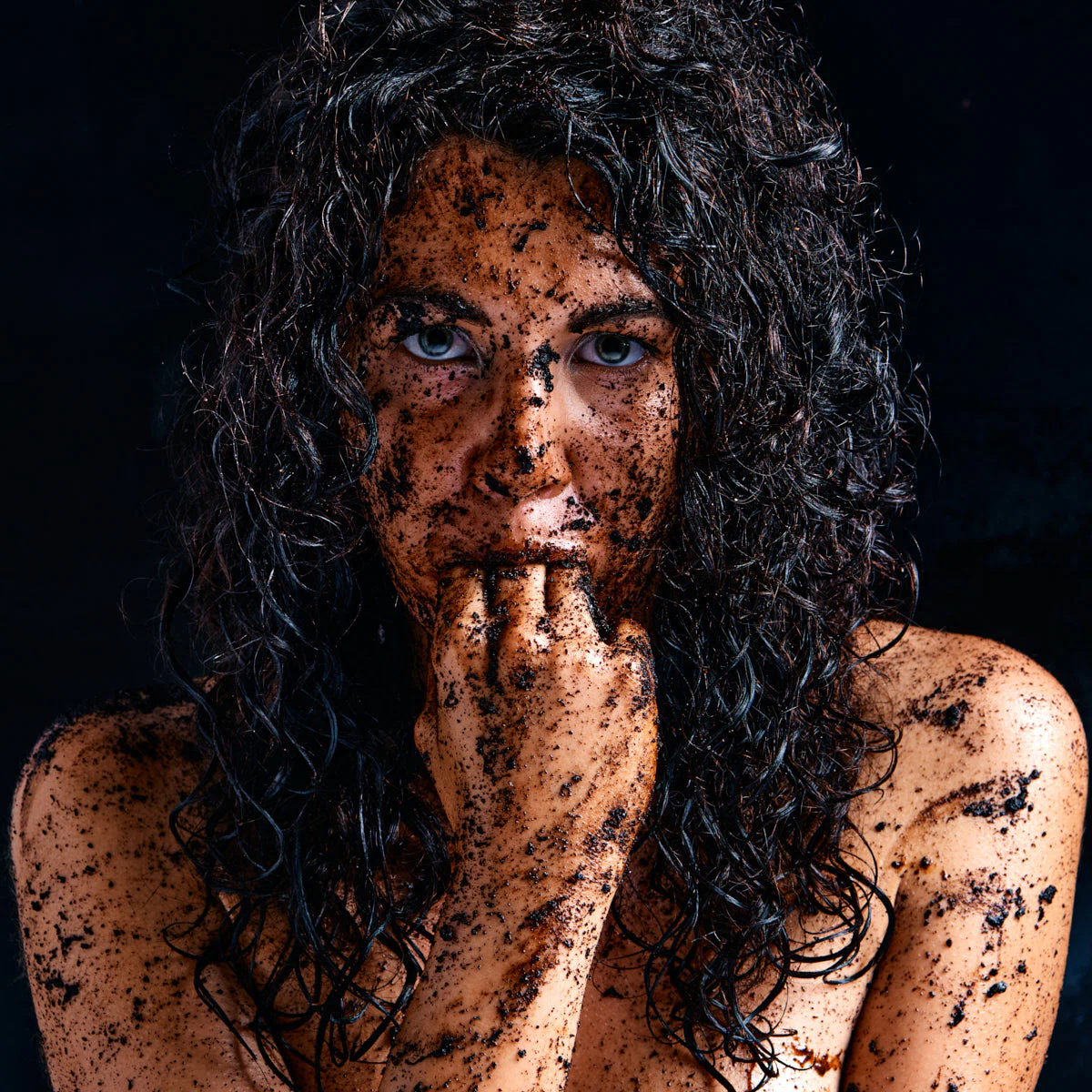 Gia Ren in the Dirty Thoughts series, captured in gritty close-up portraits with dirt on her face and intense, provocative expressions.