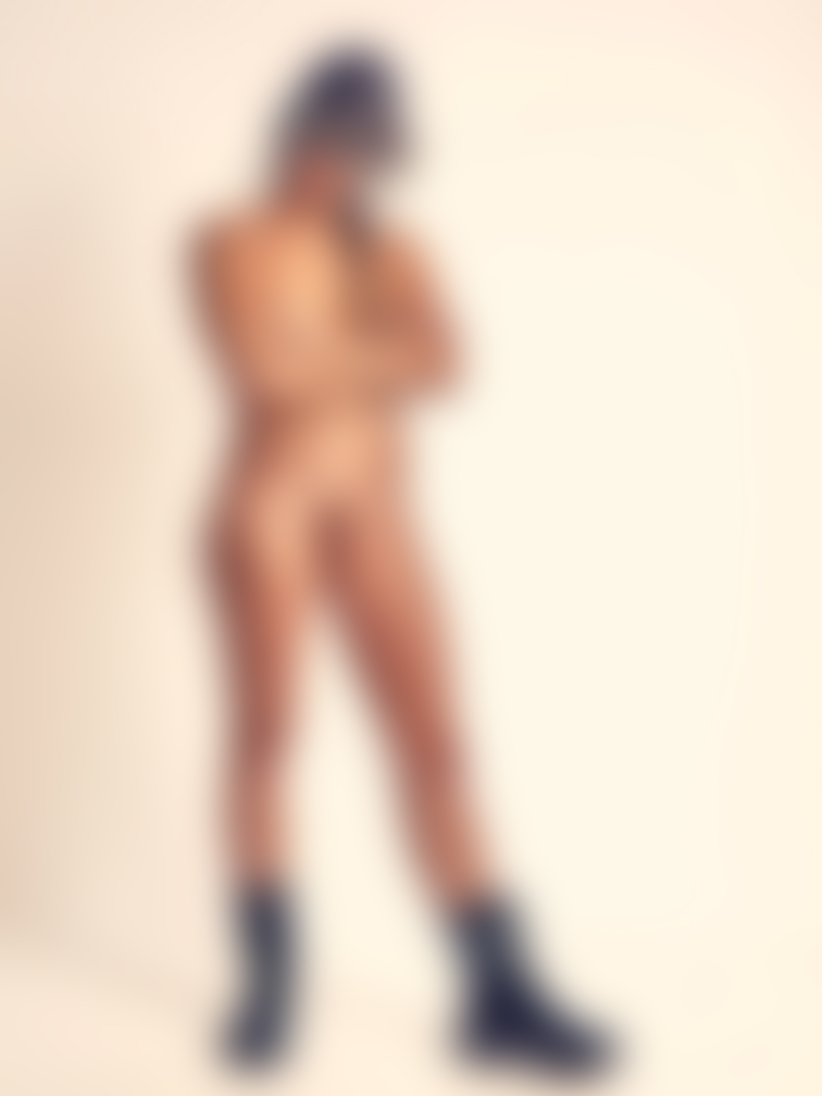 Joy Lamore nude wearing vintage aviator cap, goggles, and boots, captured in cinematic erotic fine art