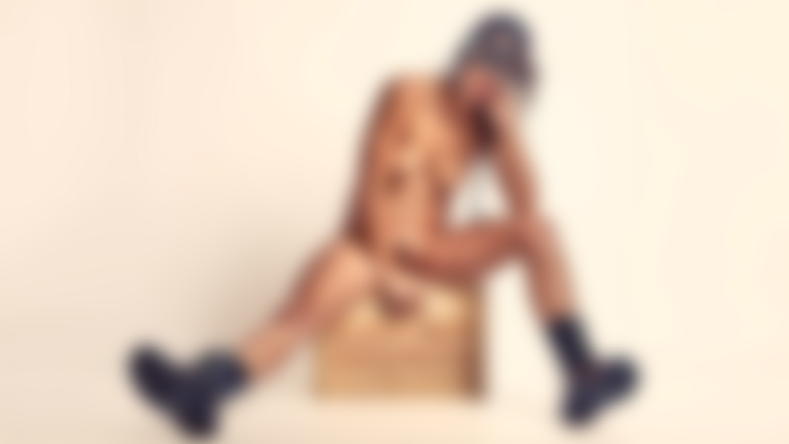 Bold erotic fine art portrait emphasizing expressive pose, playful vintage aviation styling, and confident presence