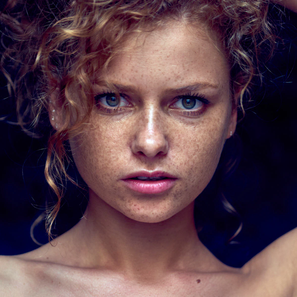 Portrait of Julia Yaroshenko with red hair, expressive face