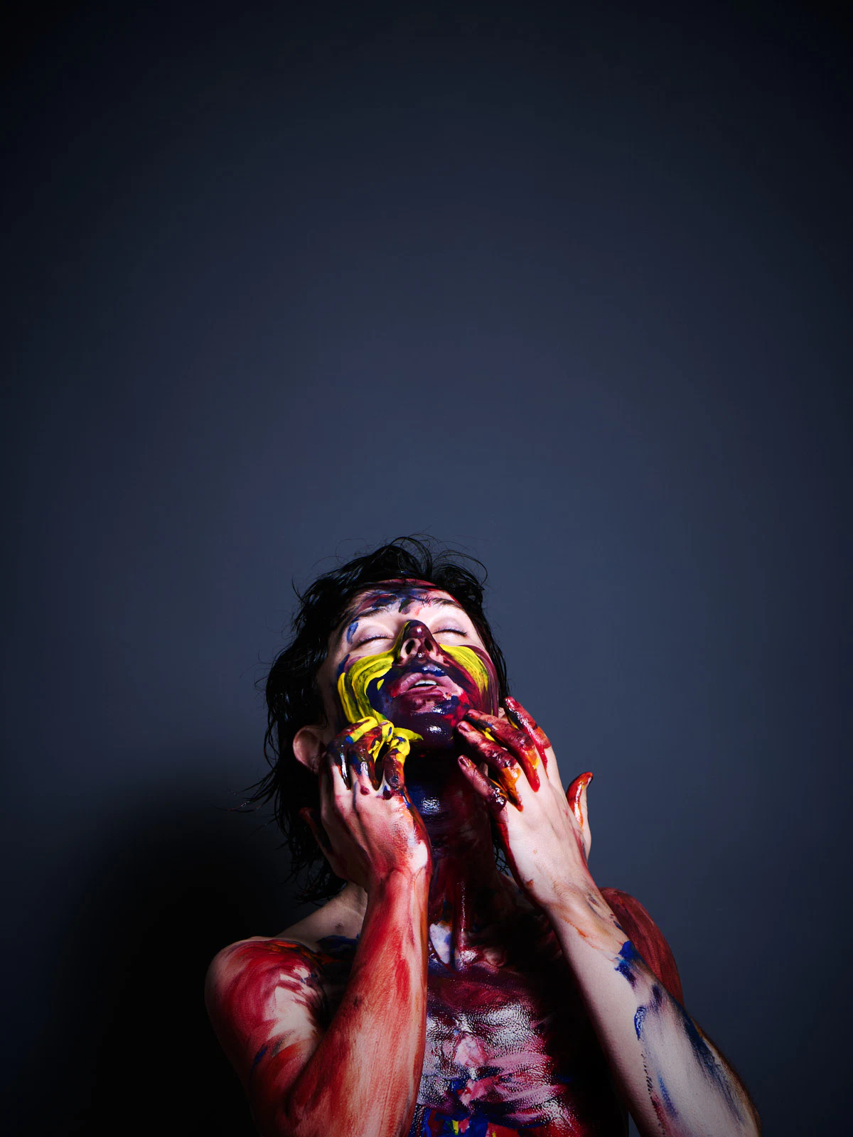 Ulah Bauer German nude model Colored Emotion paint smearing vibrant colors dark backdrop Cinaed Dane studio