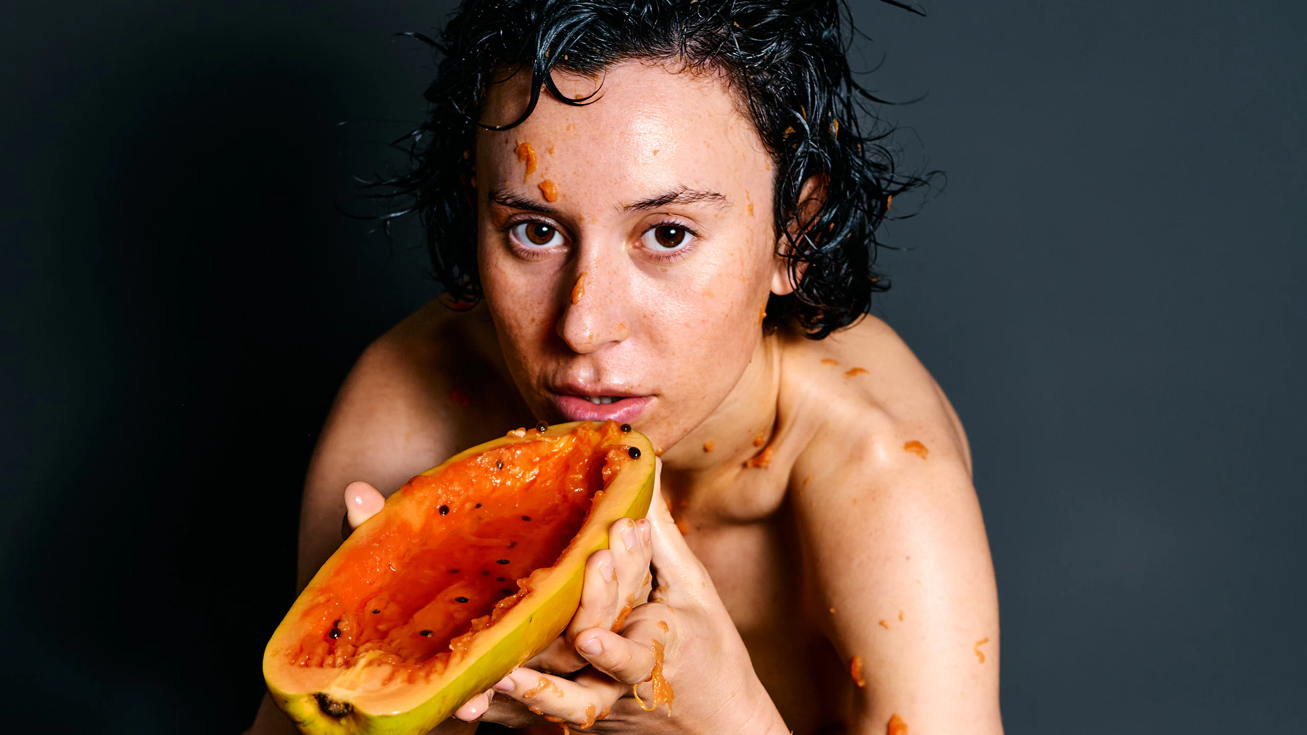 Spain-based German model Ulah Bauer Wet Papaya explicit pose orange fruit contemporary nude art Barcelona photographer