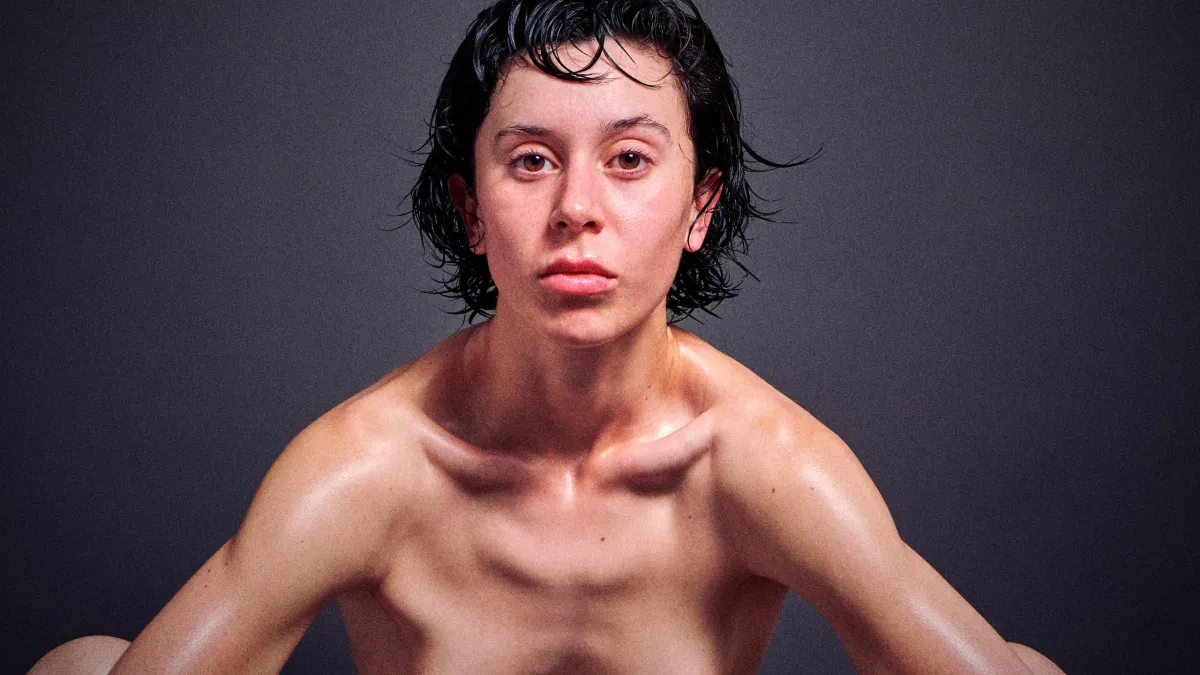 Italian nude art model Chiara Bianchino as nude lioness in fierce outdoor photography by Cinaed Dane