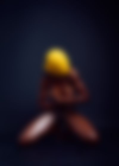 Yellowhead explicit erotic photography anonymous dark-skinned model yellow beanie concealed identity elegant poses contrast restraint visual power by Cinaed Dane