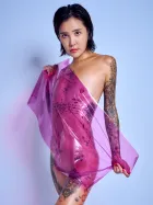 South Korean tattooed model Chloe Purple Wrap purple cellophane expressive nude light blue backdrop Barcelona photographer Cinaed Dane