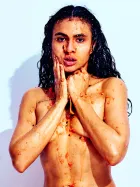 Brown Sugar nude interacting with tropical fruit, captured in expressive and sensual fine art