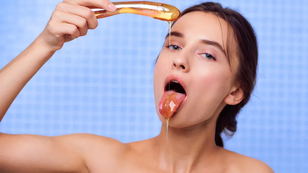 Gloria Sol posing in honey-covered erotic art portrait